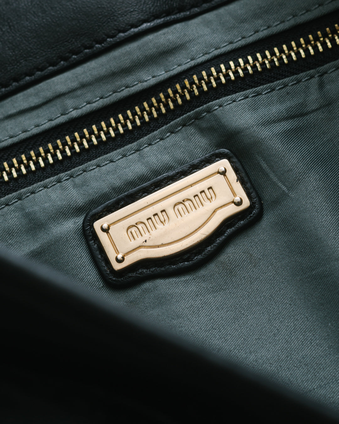 Miu miu matelasse coffer bag in black