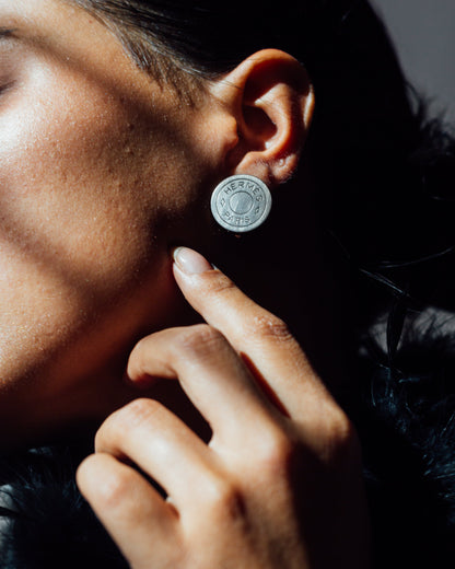 Logo embossed clip on earrings