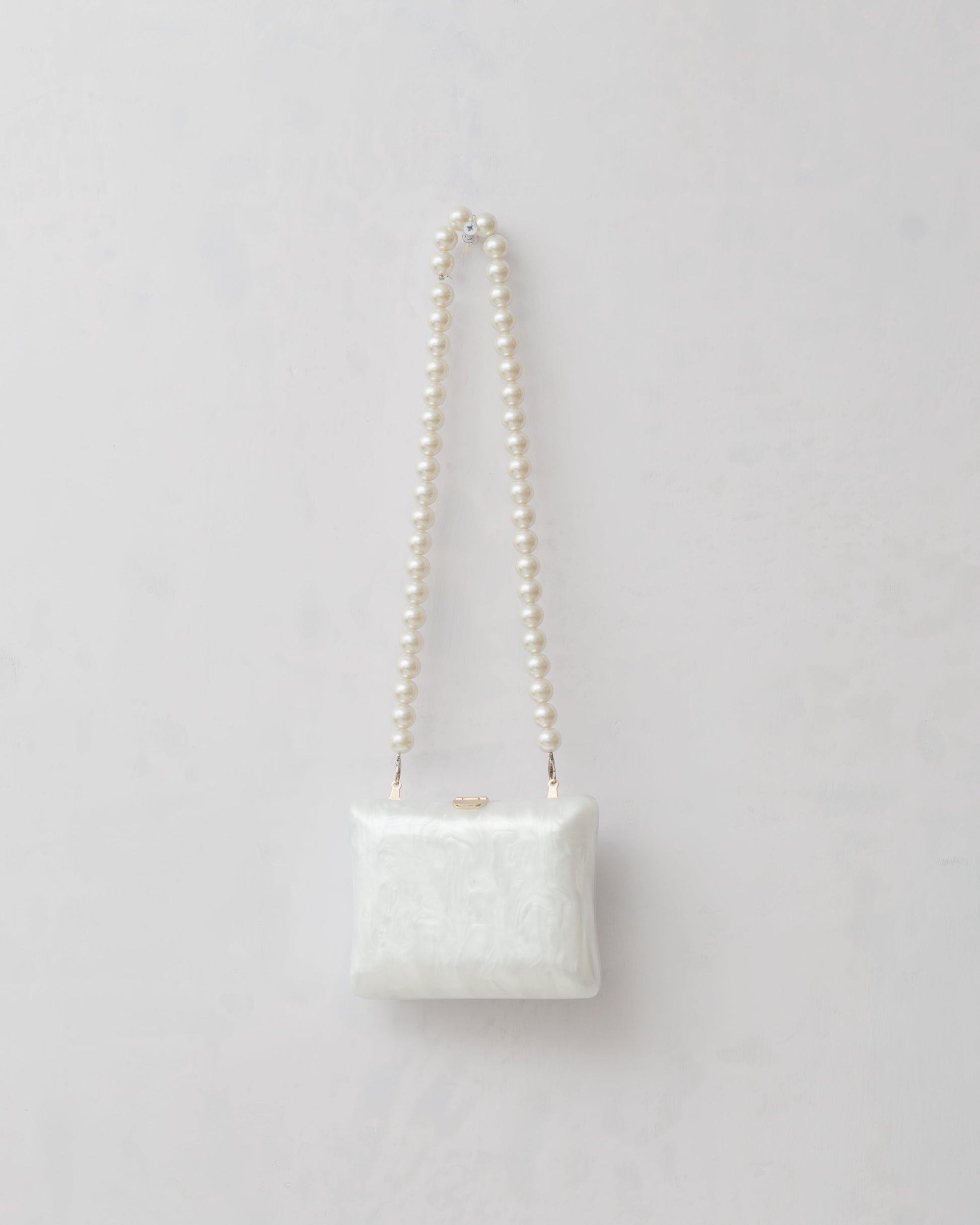 Marble textured snap lock crossbody bag