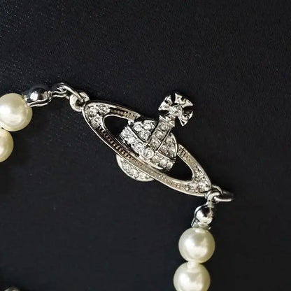 Pearl bracelet with rhinestone detailed orb