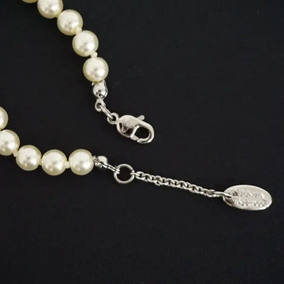 Pearl bracelet with rhinestone detailed orb