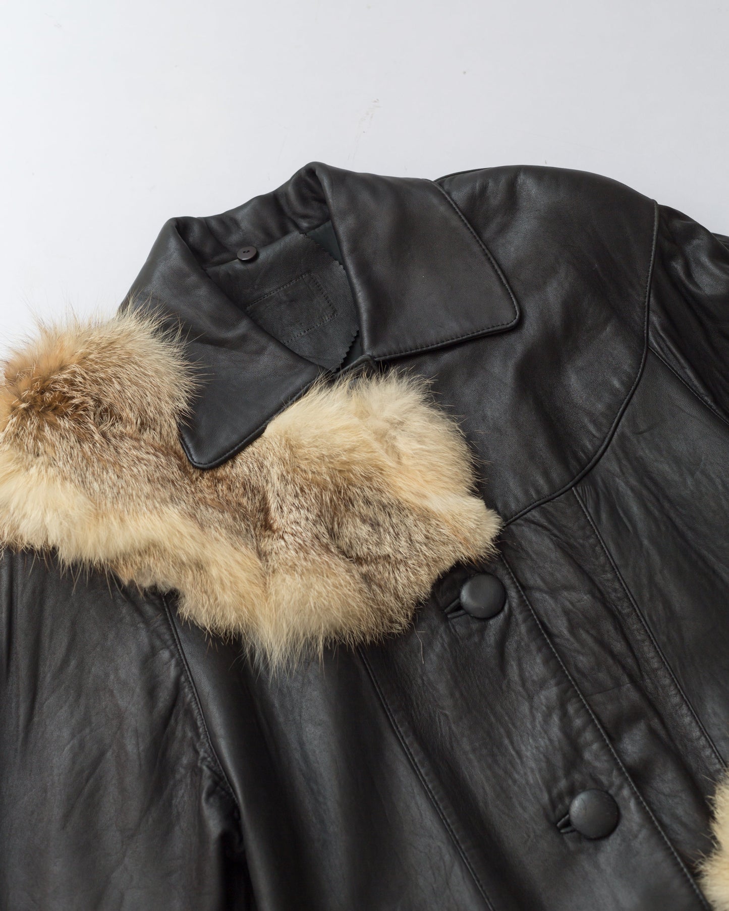 Upcycled cropped leather jacket with vintage fur details