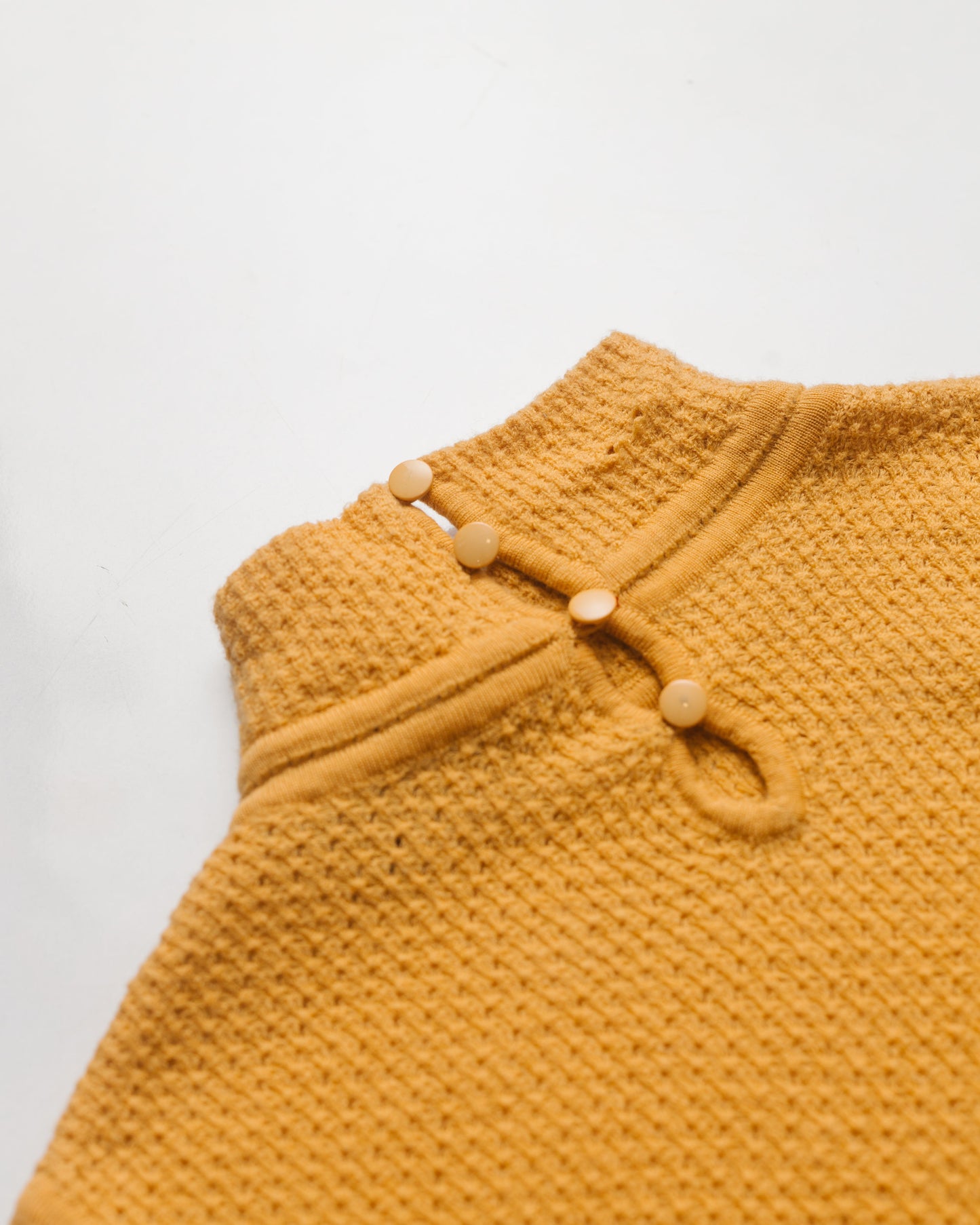 Waffle textured mock neck knit top