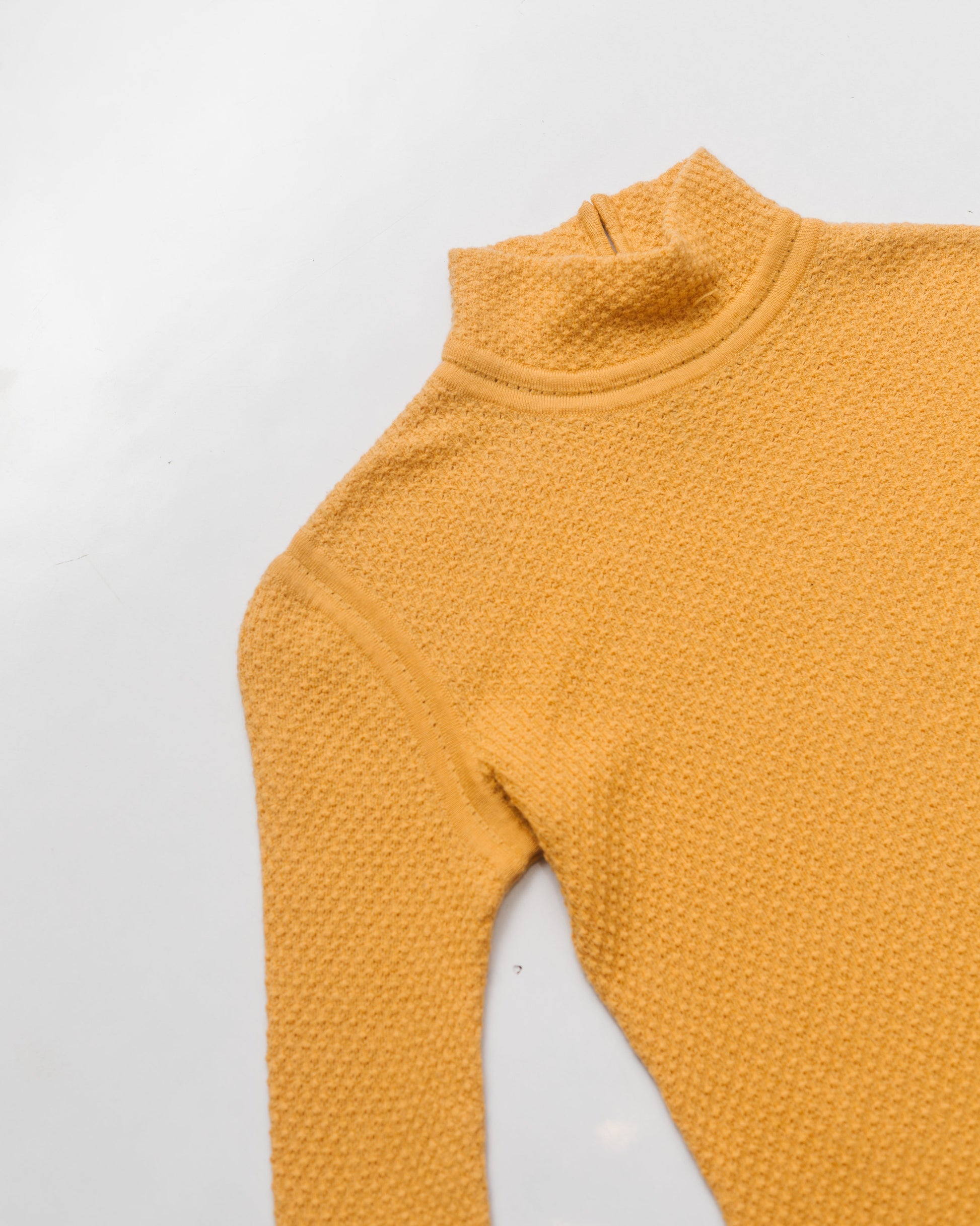 Waffle textured mock neck knit top