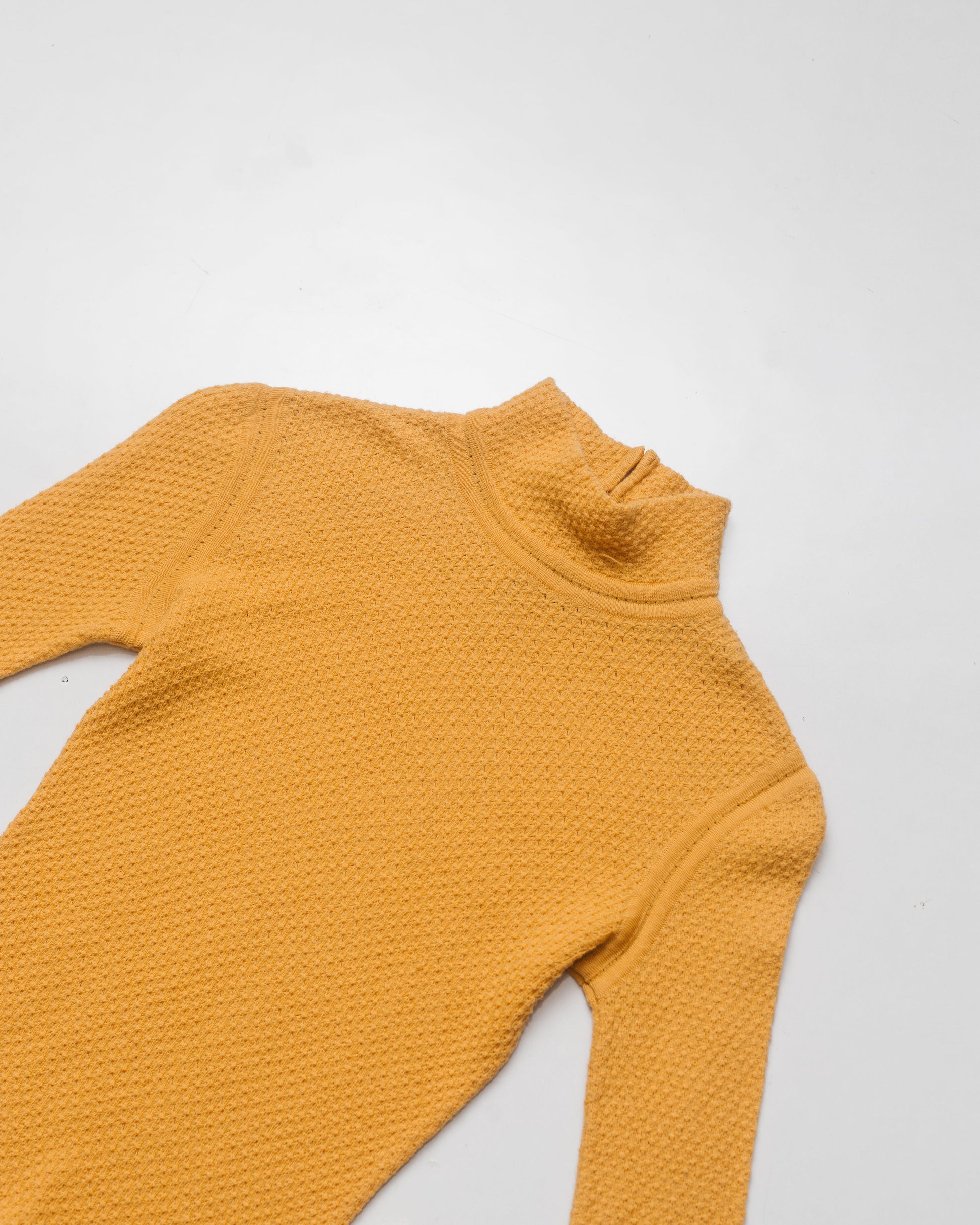 Waffle textured mock neck knit top